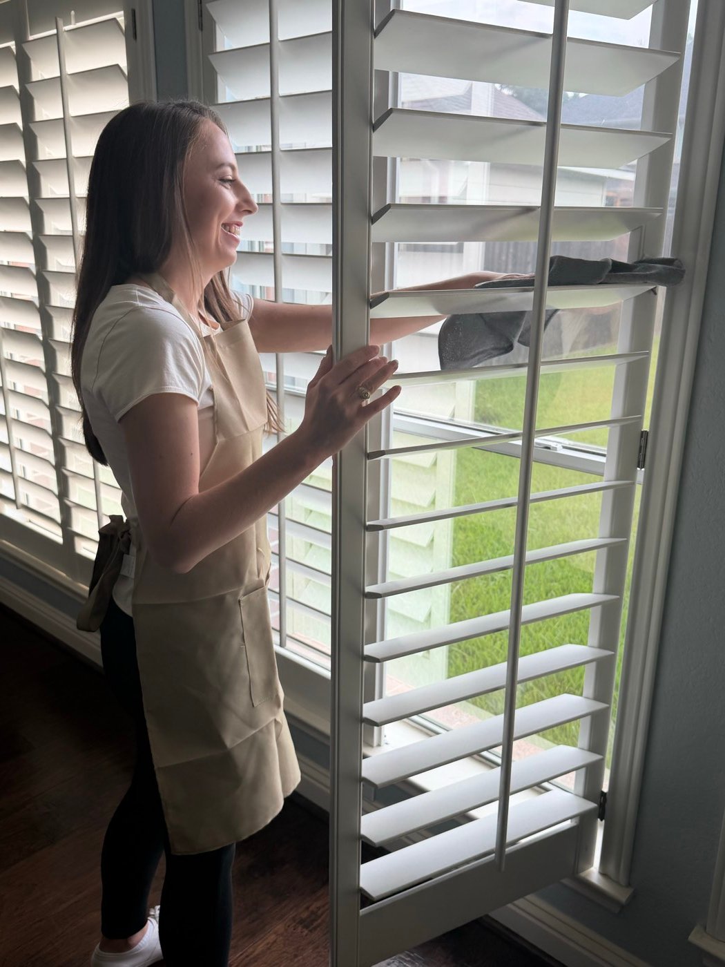 Freedom Cleaning Co. team member detailing shutters in a client's home