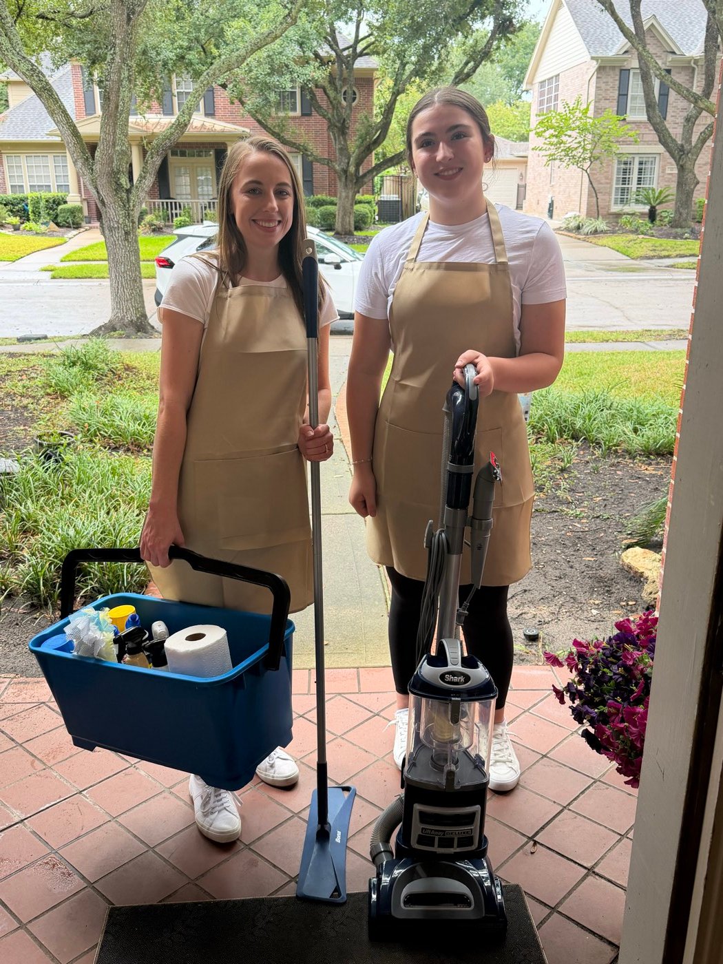 Freedom Cleaning Co. team members ready to clean with their supplies